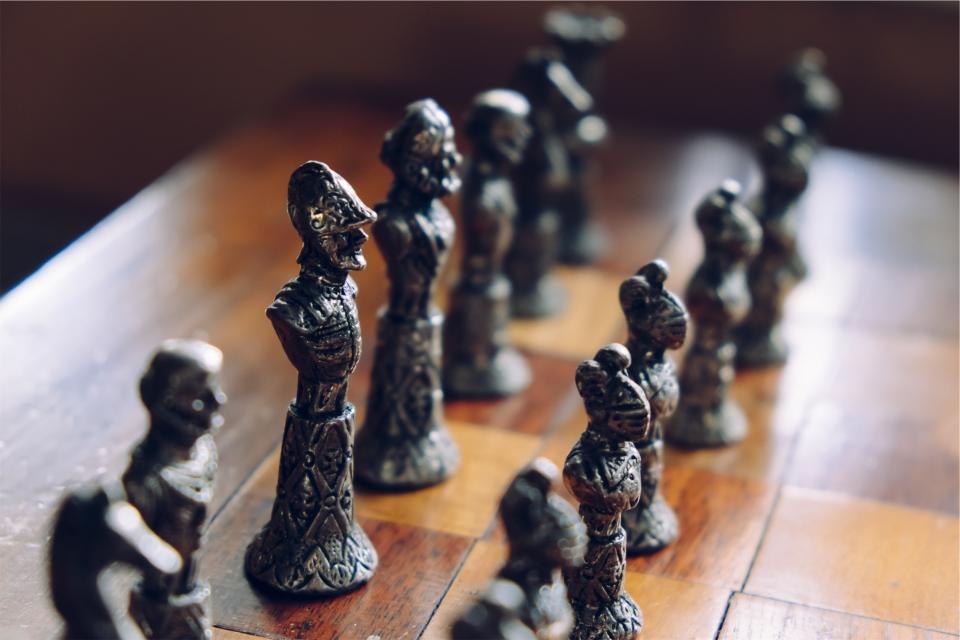 Chess pieces set on a board